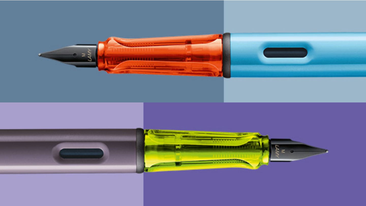 zwei gegenlaeufige Al-star FFuellhalter mit neonfarbenem Griffstueck